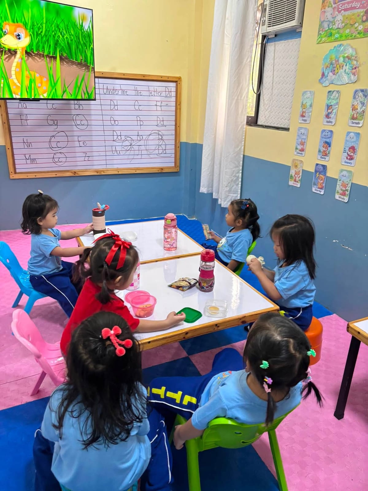 Children having snacks around the table